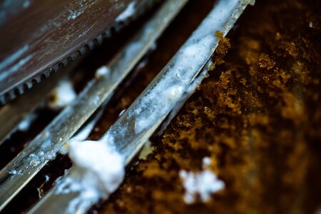 fork knife and spoon covered with apple pie icing on empty baking paper trayの写真素材