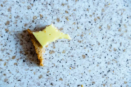 bitten rye bread and cheese sandwich closeup viewの写真素材