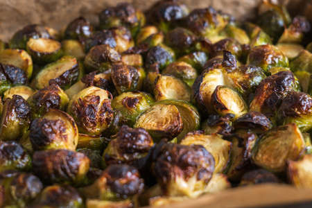 oven baked sliced brussels sprouts on baking tray closeupの写真素材
