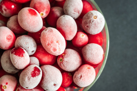 frozen red cranberries background closeup