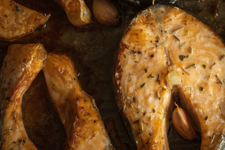 cooked salmon filets on baking tray closeup