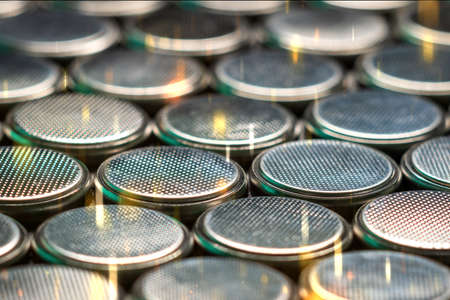 CR2032 coin cell batteries background closeup pan slideの写真素材