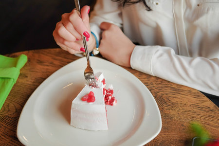 Businesswoman in a white shirt at lunch in a cafe or restaurant