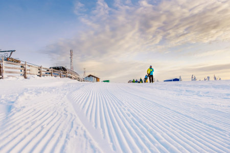 The track for snowboarding and skiing on the background of blue mountains. A beautiful morning in...