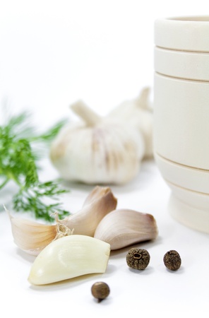 garlic and pepper on a white backgroundの写真素材