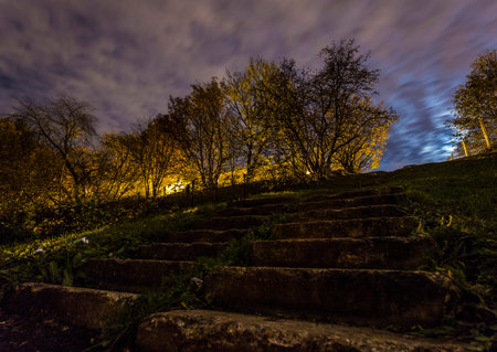 Night view of the stairs in the city park. Autumn landscape.