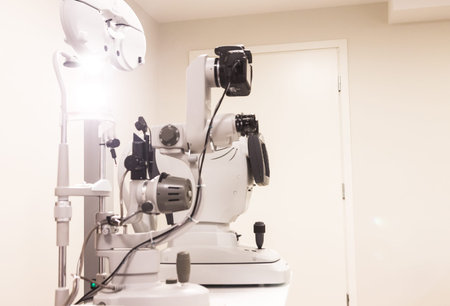 the cabinet of the eye doctor. slit lamp with cameram, autorefractometer and phoropter