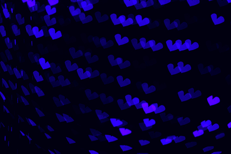 The bokeh of heart shape from the beautiful colourful light decoration at nightの写真素材