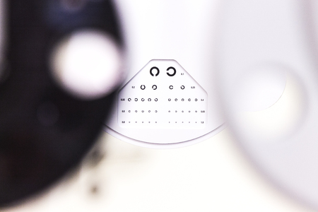 the cabinet of the eye doctor. eye sight test called landolt C. with copy spaceの写真素材