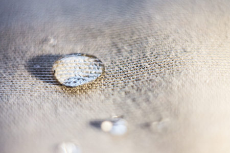 A drop of water on the surface of the tissue. Macro view. selective focus