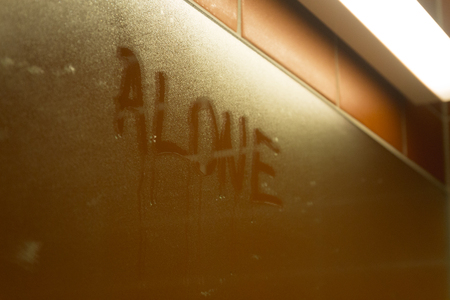 inscription text on sweaty wet glass - Aloneの写真素材