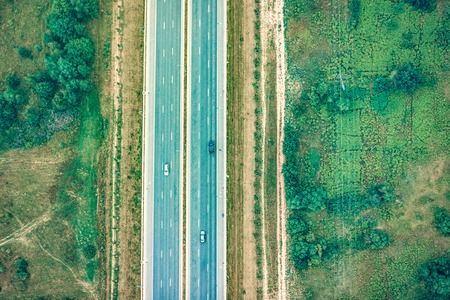 Top view of the highway with cars in nature in the summerの写真素材