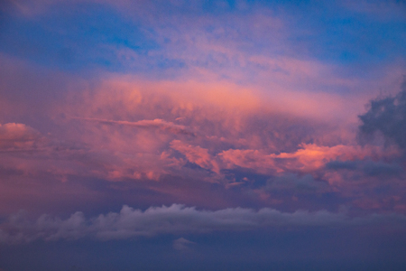 dramatic blue sky with orange clouds at sunsetの写真素材