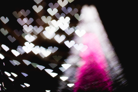 The bokeh of heart shape from the beautiful colourful light decoの写真素材