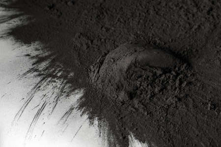 Bamboo coal powder texture black background.の写真素材