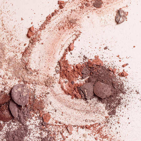 Crashed eyeshadow. Macro texture of make-up on beige backgroundの写真素材
