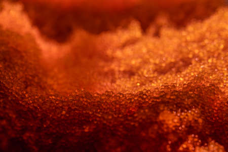 Tobiko, flying fish roe full frame macro close up. Sea of red caviarの写真素材