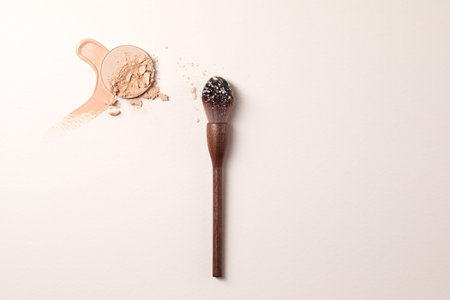 Crashed beige face finishing and liquid powder and zero waste wood finishing powder brush. Macro...
