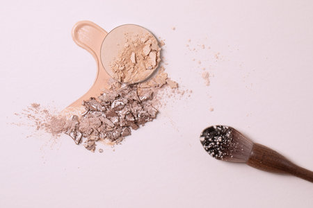 Crashed beige face finishing and liquid powder and zero waste wood finishing powder brush. Macro...