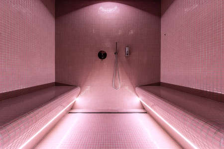 Modern steam sauna with small tiles, shower and a seat. Hamam, traditional turkish sauna.の写真素材