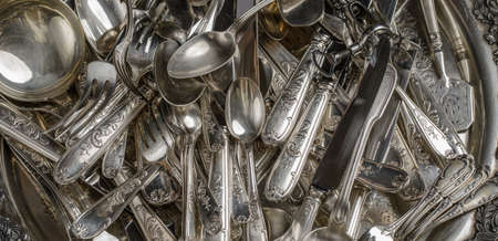 Full frame of vintage collection of silverware.の写真素材