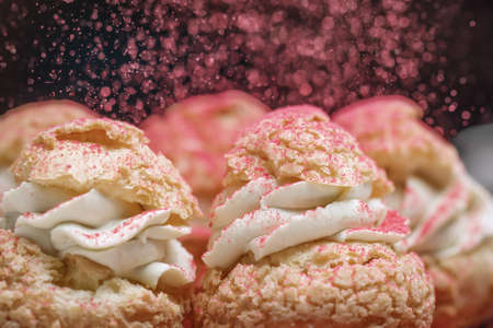 Homemade profiteroles. Profiteroles (choux Ã  la crÃ¨me) - French pastry balls filled with custard or cottage cheese sprinkled with powdered sugarの写真素材