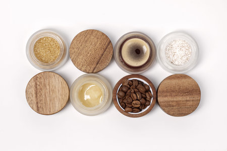 Brown sugar, coffee and honey ingredients for scrub in glass jars with wooden lid for homemade...