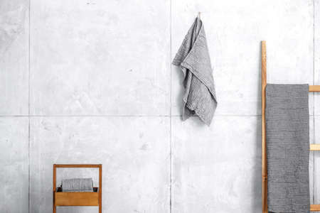 Organic waffle linen towels, bamboo toothbrushes, bathroom zero waste accessories in grey shades in contemporary bathroom interior. Daily body care, spa and wellness zero waste bathroom conceptの写真素材