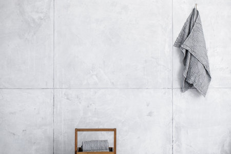 Organic waffle linen towels, bamboo toothbrushes, bathroom zero waste accessories in grey shades in contemporary bathroom interior. Daily body care, spa and wellness zero waste bathroom conceptの写真素材