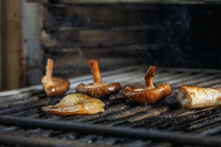 Process of grilling seafood on a barbecue grill over hot coal. Seafood recipesの写真素材