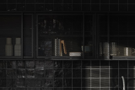 Small kitchen interior in grey and black colours, concrete wall design, black tiles. Contemporary interior design aestheticsの写真素材
