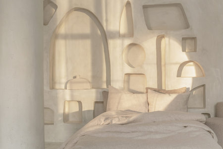 Cozy bedroom interior with trendy organic natural linen bedclothes. Eco-friendly home textiles, bed linen. Hypoallergenic material for sensitive skin. Japandi bedroom conceptの写真素材