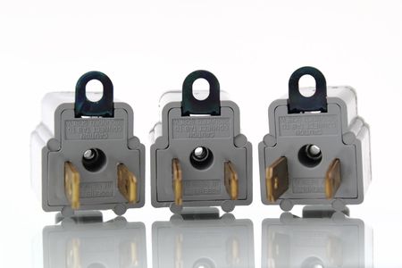 Gray electrical outlet plugin converters with reflection on isolated white backgroundの写真素材