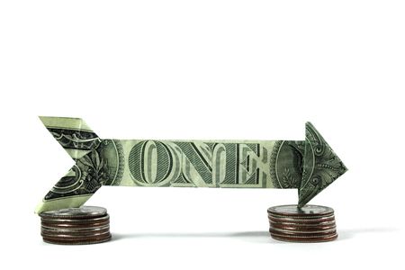 arrow made of usd currency. Shows one way directionの写真素材