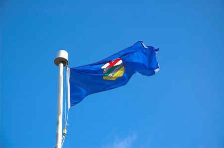 Flag of Alberta Canada blowing in the wind.の写真素材