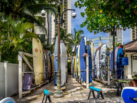 Surfboard rentals waiting for tourists on Waikiki beach on April 29, 2014 in Oahu  Waikiki beach is beachfront neighborhood of Honolulu, best known for white sand and surfing  のeditorial素材