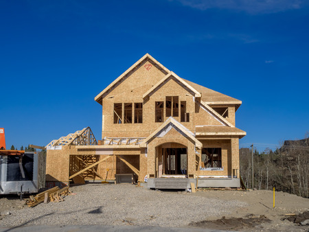 Suburban estate home under construction in Aspen Woods on April 26 2015 in Calgary Alberta. のeditorial素材