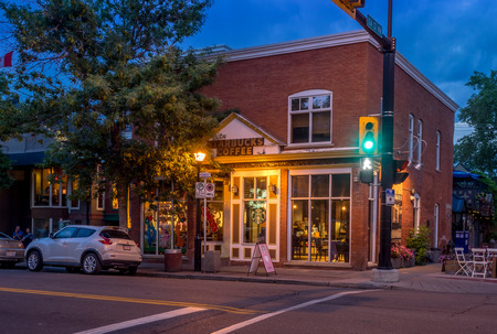Buildings in Calgary's Kensington area on June 12, 2015. It is known for trendy restaurants, nightlife, galleries and upscale shops, all popular with locals and tourists.のeditorial素材