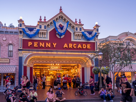 ANAHEIM, CALIFORNIA - FEBRUARY 15: Tourists enjoying Main Street Disneyland in the evening on February 15, 2016 in Anaheim, California. Disneyland is Walt Disney's original theme park.のeditorial素材