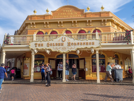 ANAHEIM, CALIFORNIA - FEBRUARY 14: The Golden Horseshoe restaurant at Disneyland in the evening on February 14, 2016 in Anaheim, California. Disneyland is Walt Disney's original theme park.のeditorial素材