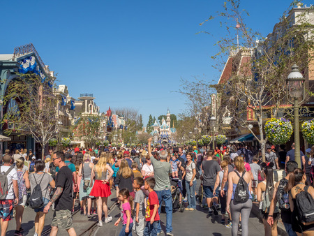 ANAHEIM, CALIFORNIA - FEBRUARY 15: Tourists enjoy Main Street USA at the Disneyland Park on February 15, 2016 in Anaheim, California. Disneyland is Walt Disney's original theme park.のeditorial素材