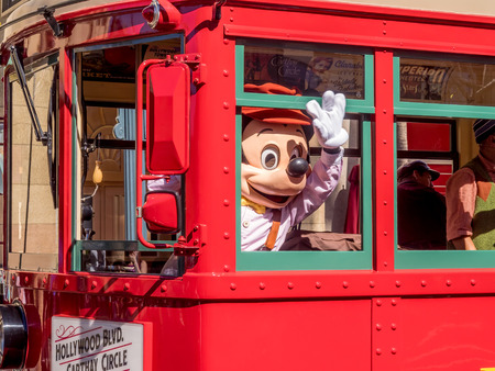 ANAHEIM, CALIFORNIA - FEBRUARY 15: Mickey Mouse riding the Red Car Trolley at Disney California Adventure Park on February 15, 2016 in Anaheim, California. Disney California Adventure Park is themed after the history and culture of California.のeditorial素材