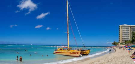 HONOLULU, HI - AUG 3: A catamaran waiting for tourists at Waikiki Beach on August 3, 2016 in Honolulu. Catamarans are a popular tourist activity at Waikiki Beach and offers a unique experience.のeditorial素材