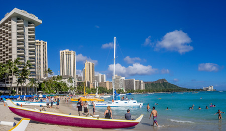 HONOLULU, HI - AUG 4: A catamaran waiting for tourists at Waikiki Beach on August 4, 2016 in Honolulu. Catamarans are a popular tourist activity at Waikiki Beach and offers a unique experience.のeditorial素材