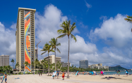 HONOLULU, USA - AUG 7: Sun lovers on Waikiki beach at the Hawaiian Hilton on August 7, 2016 in Honolulu, Usa. Waikiki beach is neighborhood of Honolulu, best known for white sand and surfing.のeditorial素材