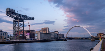 GLASGOW, SCOTLAND - JULY 21: The River Clyde with the Clyde Arc Bridge on July 21, 2017 in Glasgow, Scotland. Glaswegians call the Clyde Arc the squinty bridge due to its meandering path across.のeditorial素材