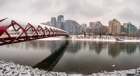 A pedestrian bridge over the Bow River in Calgary Alberta on a cold winter day.のeditorial素材
