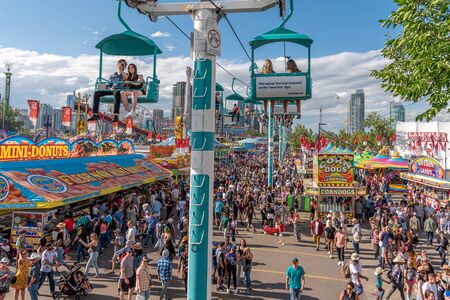 Calgary, Alberta - July 13, 2019: Sights and sounds of the Calgary Stampede grounds. The Calgary Stampede is one of the largest agricultural, rodeo and midways in the world.のeditorial素材