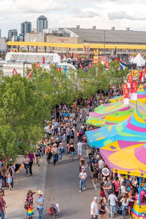 Calgary, Alberta - July 13, 2019: Sights and sounds of the Calgary Stampede grounds. The Calgary Stampede is one of the largest agricultural, rodeo and midways in the world.のeditorial素材