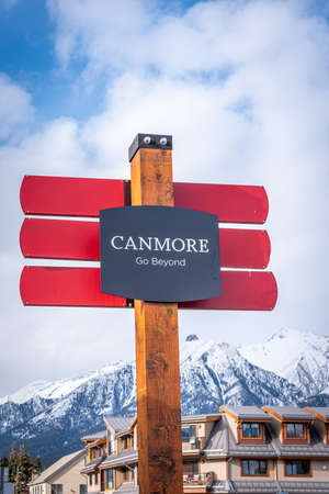 Canmore, Alberta - April 4, 2020: Town of Canmore signage with beautiful mountains in the background.のeditorial素材